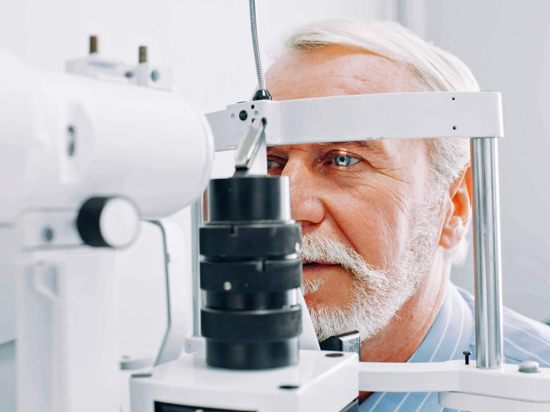 Eyesight test, senior citizen, man, ophthalmologist, eye test, optician, slit lamp, glaucoma, vision impairment, ophthalmology