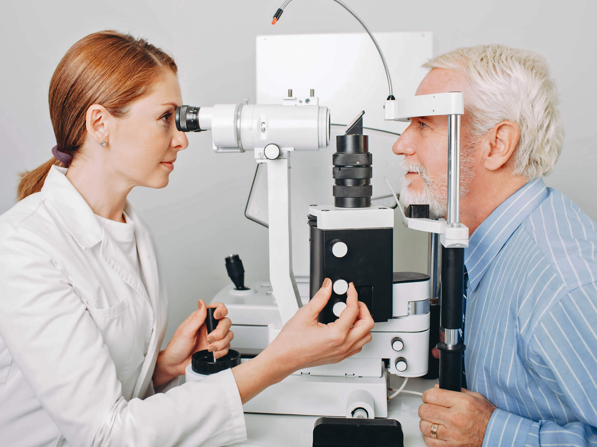 Eyesight test, senior citizen, man, female ophthalmologist, eye examination, female optician, slit lamp, glaucoma, vision impairment, ophthalmology